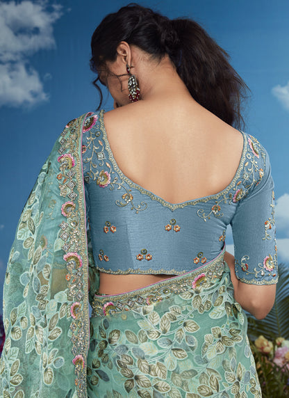 Turquoise Brasso Designer Blouse with Attached Tussles On Pallu